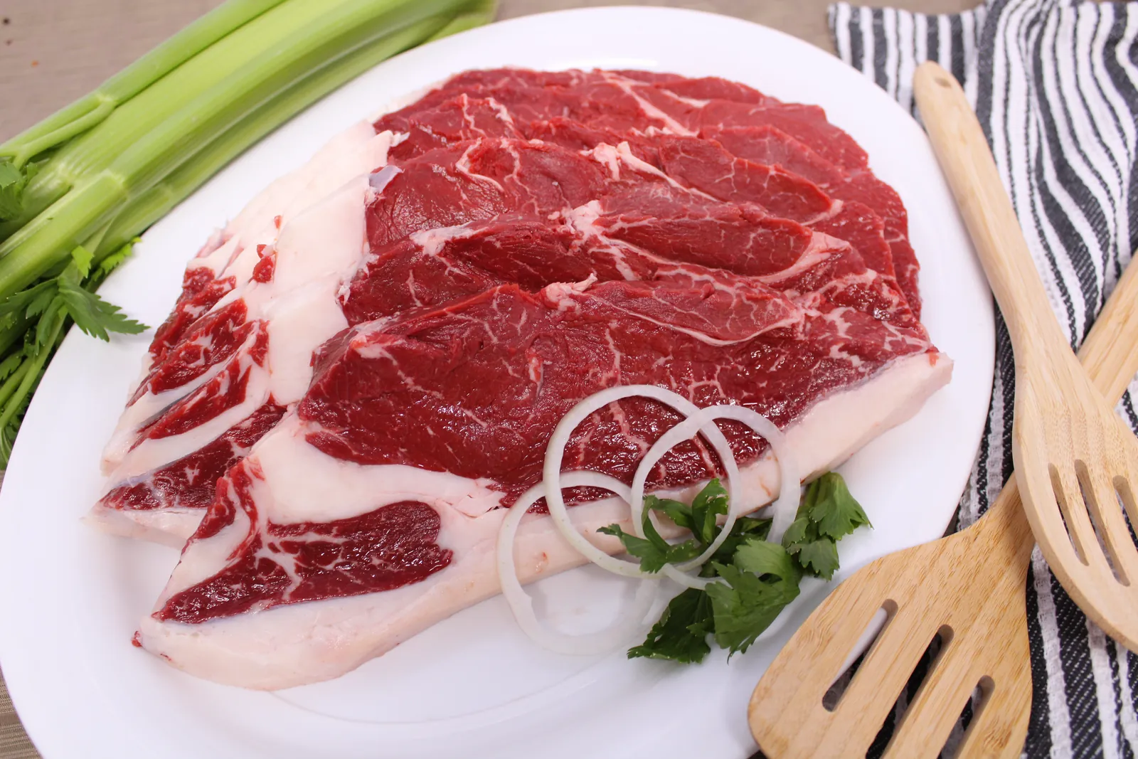 A chuck steak on a white plate