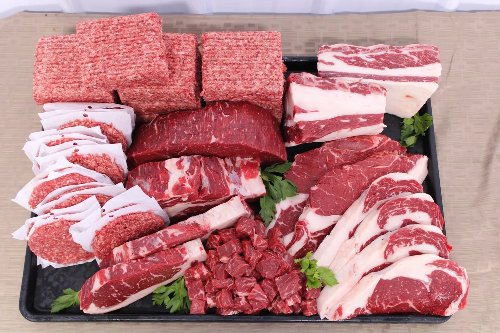 A tray of steaks, roasts, stew beef and ground beef